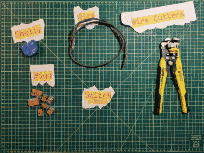 A image of wirecutters, wire, wago wire connectors and a switch (that is missing) all labled and desplayed on a cutting board