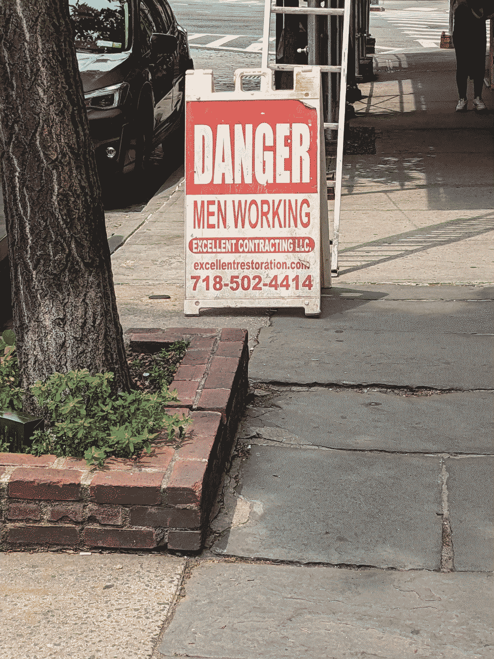 sign that says: danger men working